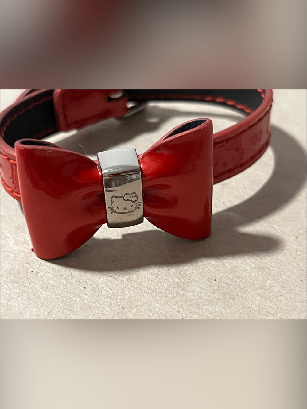 Hello Kitty Red Patent Bow Bracelet with Engraved Metal Accent